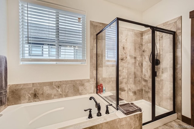 full bath featuring a shower stall and a bath