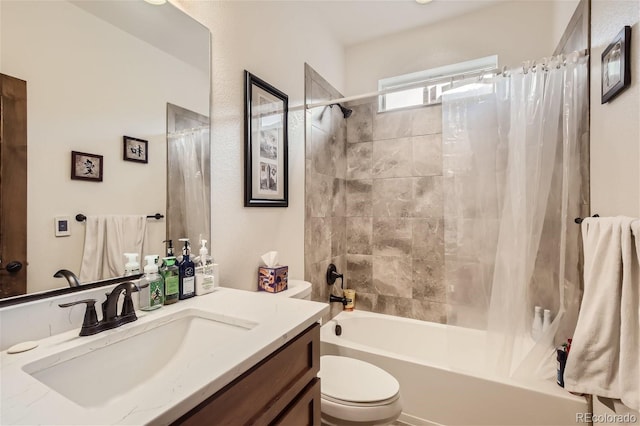 full bathroom featuring shower / bath combo, vanity, and toilet