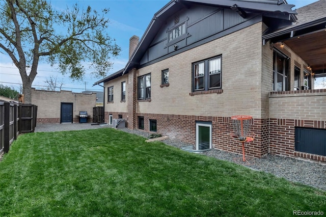 1399 Newton St, Denver, CO 80204 - rear view of property with brick siding and a chimney