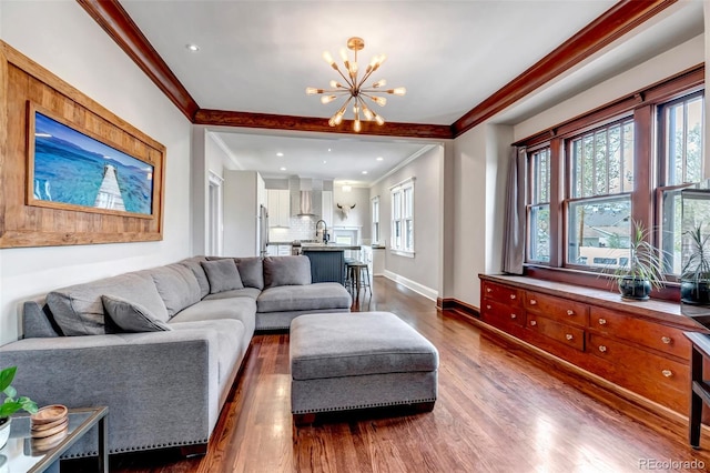 1399 Newton St, Denver, CO 80204 - living area featuring ornamental molding, a chandelier, dark wood-type flooring, baseboards, and recessed lighting