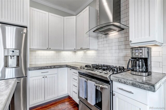 1399 Newton St, Denver, CO 80204 - kitchen with appliances with stainless steel finishes, wall chimney exhaust hood, crown molding, decorative backsplash, and white cabinetry