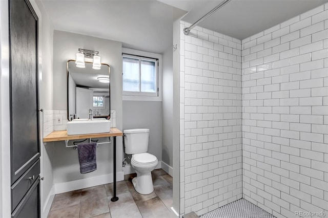 1399 Newton St, Denver, CO 80204 - full bath with toilet, tiled shower, tile patterned floors, and vanity