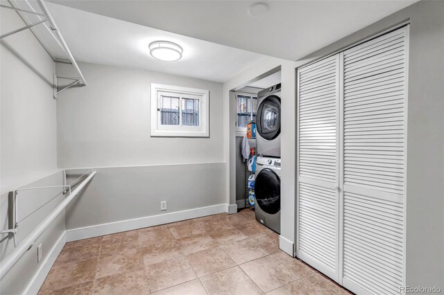 1399 Newton St, Denver, CO 80204 - laundry area featuring estacked washer and dryer and baseboards