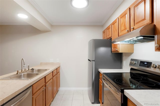 kitchen featuring ornamental molding, light countertops, under cabinet range hood, a sink, and appliances with stainless steel finishes