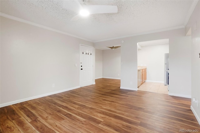 unfurnished room featuring a ceiling fan, a textured ceiling, ornamental molding, and light wood-style floors