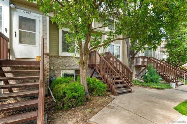 1885 S Quebec Way Unit G 106, Denver, CO 80231 - doorway to property featuring a patio and brick siding