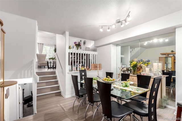 1885 S Quebec Way Unit G 106, Denver, CO 80231 - dining space featuring wood finished floors and stairway