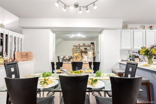 1885 S Quebec Way Unit G 106, Denver, CO 80231 - dining area with rail lighting