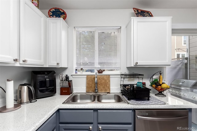 1885 S Quebec Way Unit G 106, Denver, CO 80231 - kitchen with dishwasher, healthy amount of natural light, and white cabinetry