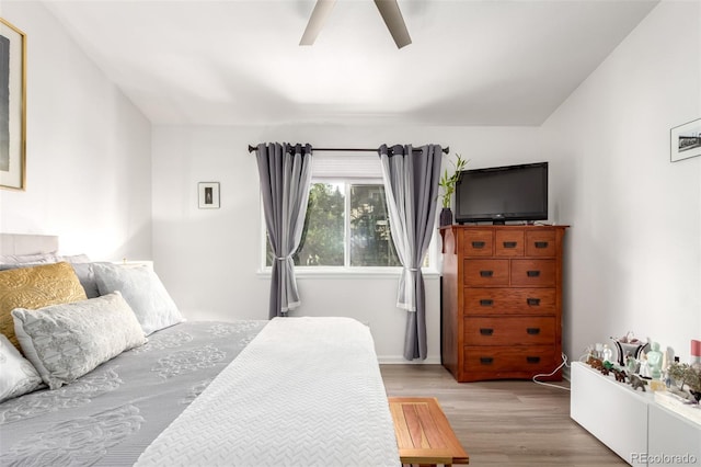 1885 S Quebec Way Unit G 106, Denver, CO 80231 - bedroom with light wood-type flooring, ceiling fan, and lofted ceiling