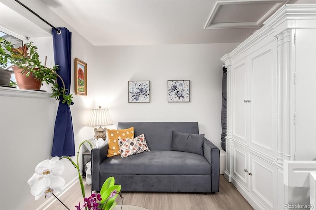 1885 S Quebec Way Unit G 106, Denver, CO 80231 - living area with wood finished floors and baseboards