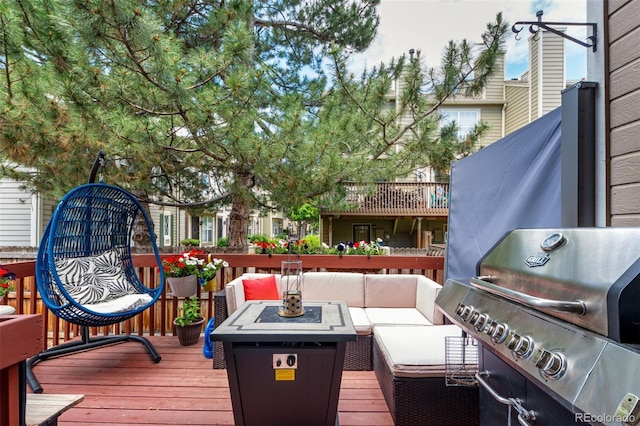 1885 S Quebec Way Unit G 106, Denver, CO 80231 - wooden deck with a grill and outdoor lounge area
