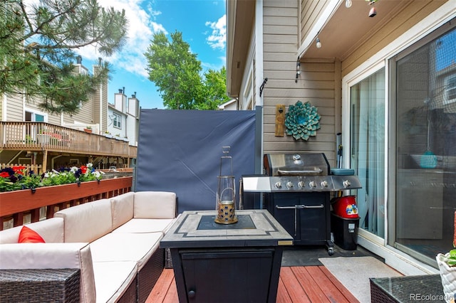 1885 S Quebec Way Unit G 106, Denver, CO 80231 - wooden terrace featuring outdoor lounge area and area for grilling