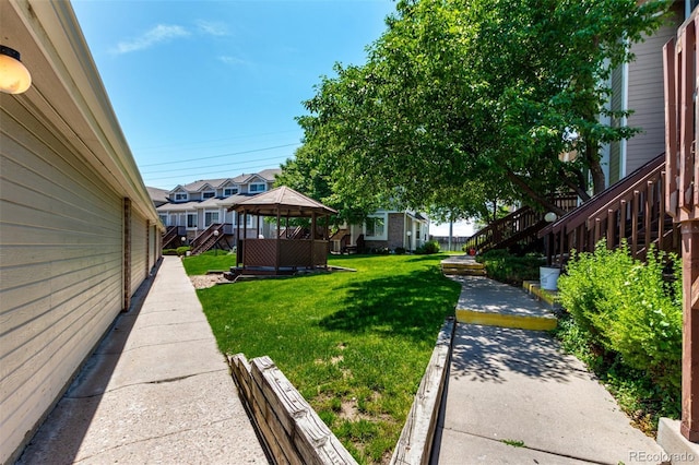 1885 S Quebec Way Unit G 106, Denver, CO 80231 - view of grassy yard with a gazebo and a patio area