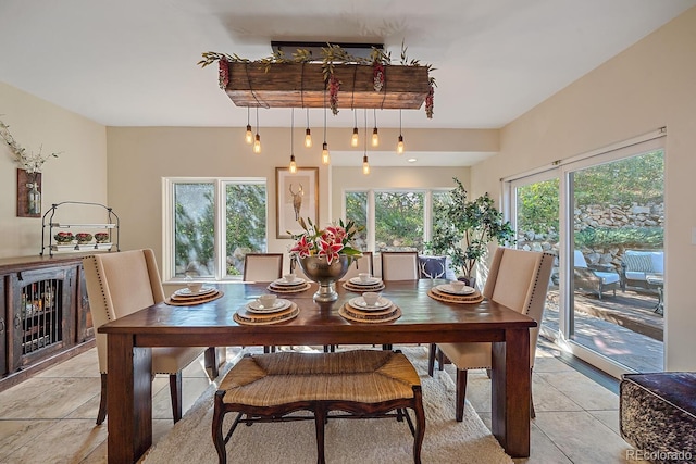 dining space featuring light tile patterned flooring