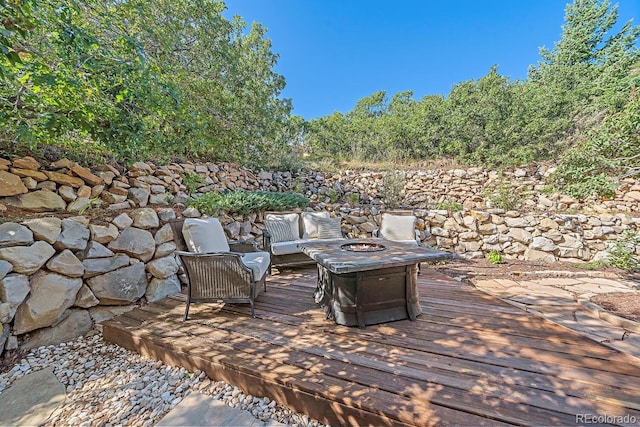 deck with an outdoor fire pit