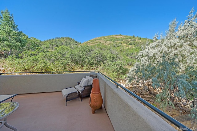 balcony featuring a mountain view