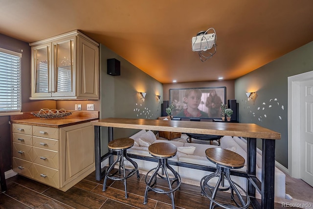 kitchen with dark hardwood / wood-style floors and cream cabinetry