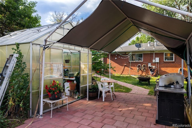 11861 Claude Way, Northglenn, CO 80233 - view of patio featuring an exterior structure and an outbuilding