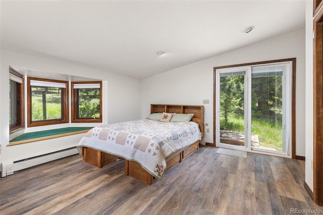 173 Silver Cloud Ln, Boulder, CO 80302 - bedroom with vaulted ceiling, a baseboard heating unit, wood finished floors, access to outside, and multiple windows