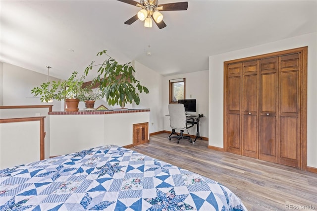 173 Silver Cloud Ln, Boulder, CO 80302 - bedroom with wood finished floors, lofted ceiling, a desk, and a ceiling fan