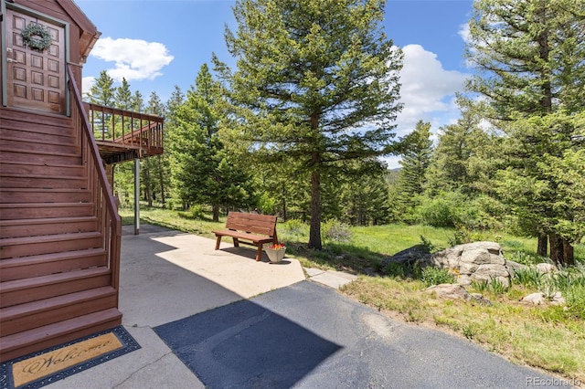 173 Silver Cloud Ln, Boulder, CO 80302 - view of patio featuring stairway and a wooden deck