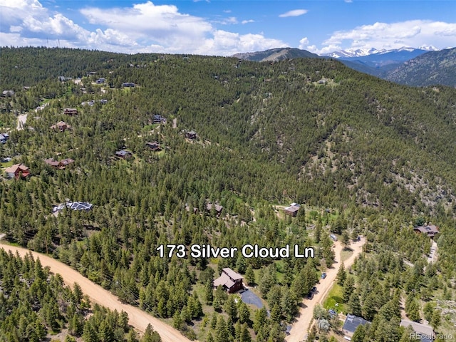 173 Silver Cloud Ln, Boulder, CO 80302 - aerial overview of property's location with a forest and a mountainous background