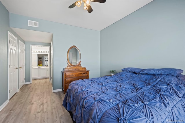 bedroom with ceiling fan, visible vents, baseboards, and light wood-style flooring