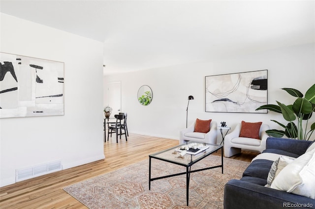8651 Franklin St, Denver, CO 80229 - living area with wood finished floors, baseboards, and visible vents