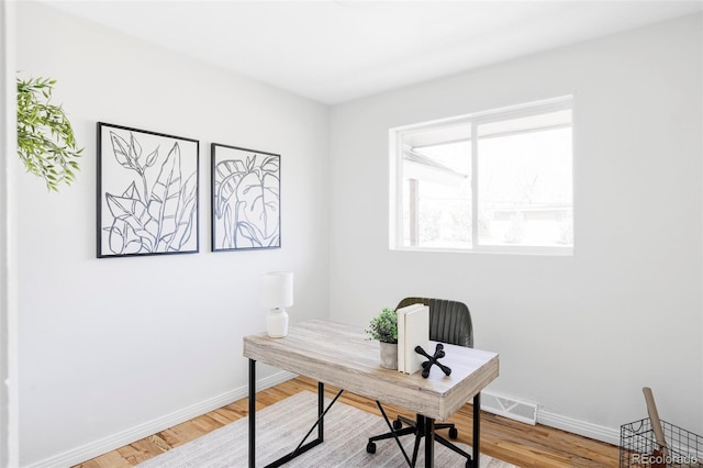 8651 Franklin St, Denver, CO 80229 - office space featuring wood finished floors, baseboards, and visible vents