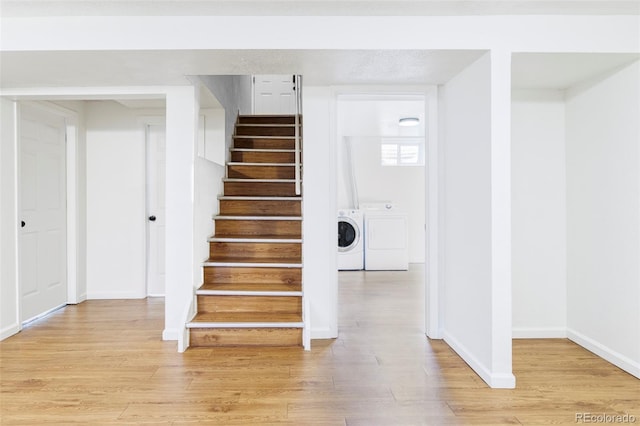 8651 Franklin St, Denver, CO 80229 - stairway with wood finished floors, baseboards, and washing machine and dryer
