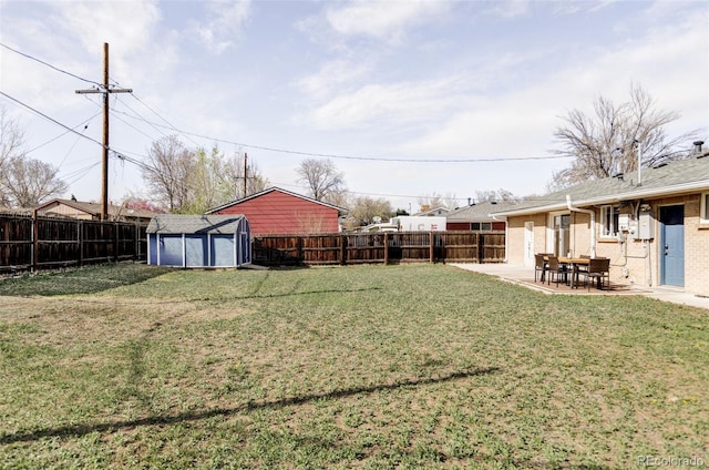 8651 Franklin St, Denver, CO 80229 - view of yard featuring a patio, a fenced backyard, a storage unit, and an outdoor structure