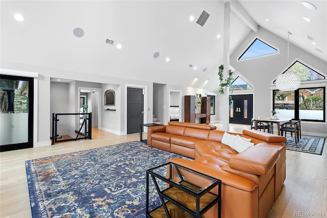 5859 E Ida Pl, Greenwood Village, CO 80111 - living area with beamed ceiling, high vaulted ceiling, visible vents, and light wood-style floors