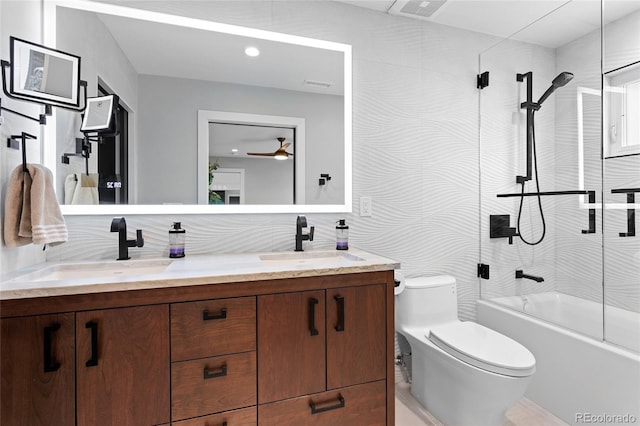 5859 E Ida Pl, Greenwood Village, CO 80111 - bathroom featuring double vanity, toilet, washtub / shower combination, and a sink