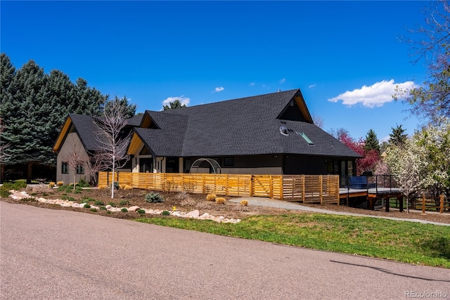 5859 E Ida Pl, Greenwood Village, CO 80111 - view of front of home featuring roof with shingles and fence