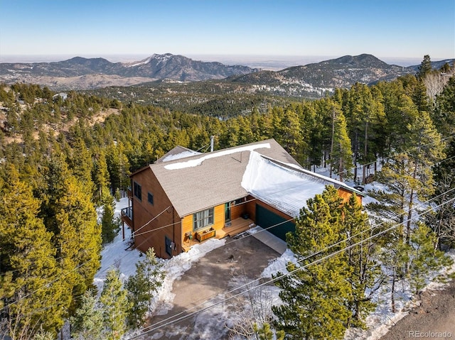 birds eye view of property featuring a mountain view