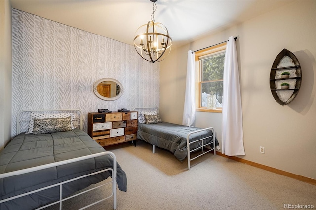 bedroom with carpet flooring and a notable chandelier