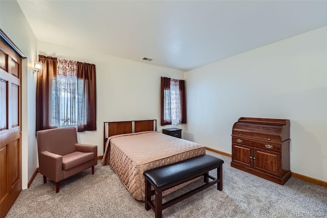 bedroom with light colored carpet