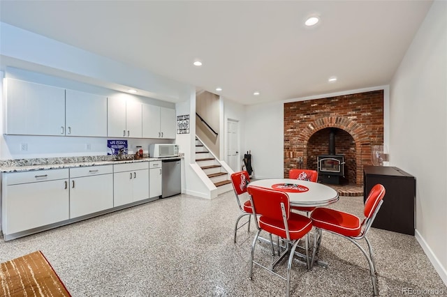 dining room featuring a wood stove