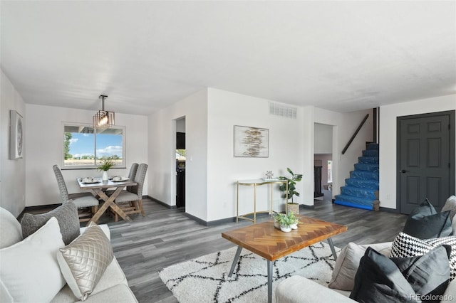 1973 Bahama St, Aurora, CO 80011 - living area with wood finished floors, stairs, and baseboards