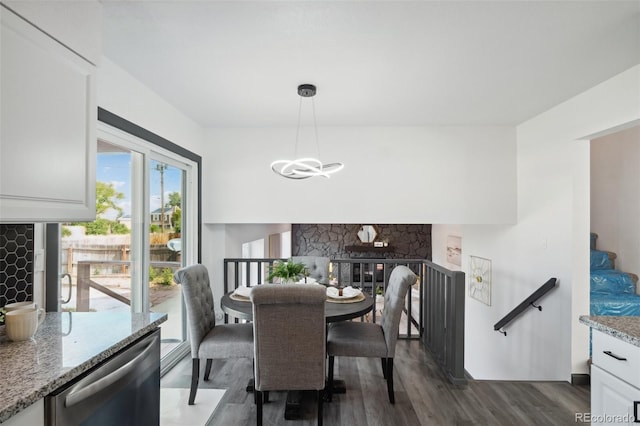 1973 Bahama St, Aurora, CO 80011 - dining space featuring dark wood finished floors and a chandelier