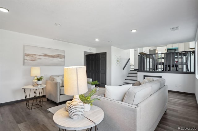 1973 Bahama St, Aurora, CO 80011 - living room with stairway, wood finished floors, baseboards, and recessed lighting