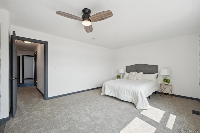 1973 Bahama St, Aurora, CO 80011 - carpeted bedroom featuring baseboards and ceiling fan