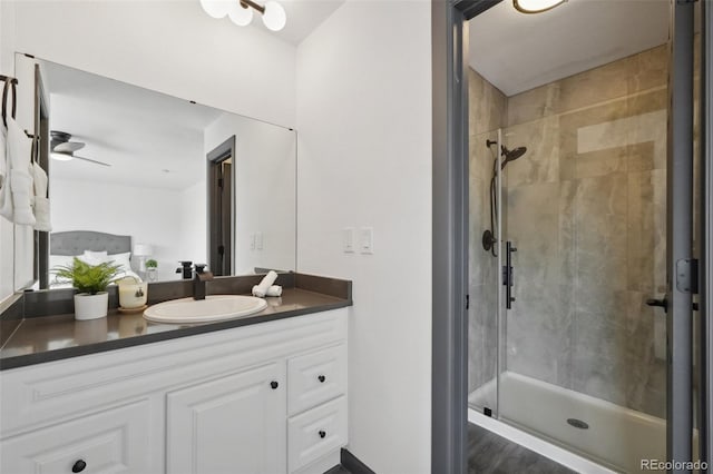 1973 Bahama St, Aurora, CO 80011 - full bath featuring a shower stall, vanity, and a ceiling fan