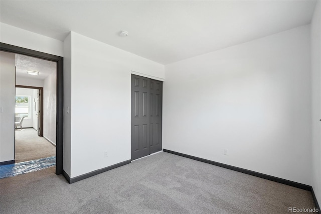 1973 Bahama St, Aurora, CO 80011 - spare room featuring carpet, baseboards, and a smoke detector