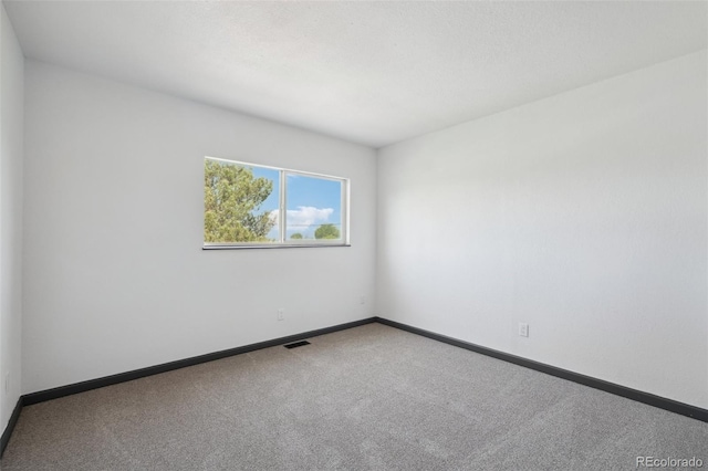 1973 Bahama St, Aurora, CO 80011 - carpeted spare room with baseboards