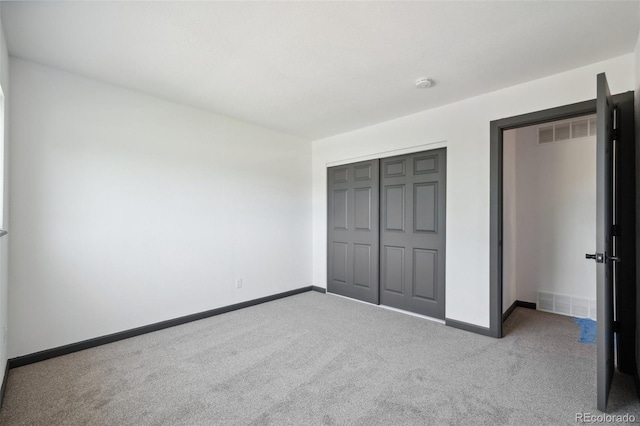 1973 Bahama St, Aurora, CO 80011 - unfurnished bedroom featuring carpet floors, baseboards, and a closet