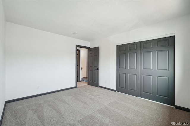 1973 Bahama St, Aurora, CO 80011 - unfurnished bedroom with carpet floors, baseboards, and a closet