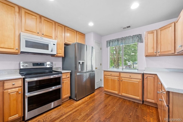 426 Plowman Way, Fort Collins, CO 80526 - kitchen with appliances with stainless steel finishes, dark wood finished floors, light countertops, and recessed lighting