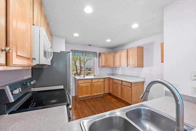 426 Plowman Way, Fort Collins, CO 80526 - kitchen with white microwave, stainless steel electric stove, dark wood-style floors, light countertops, and recessed lighting